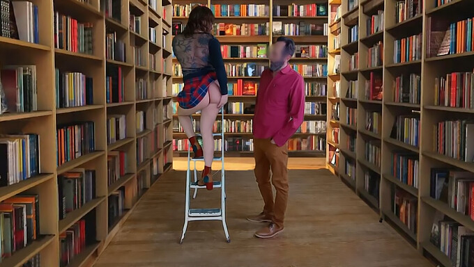 A Surprise Blowjob In The Library Leads To A Satisfying Facial